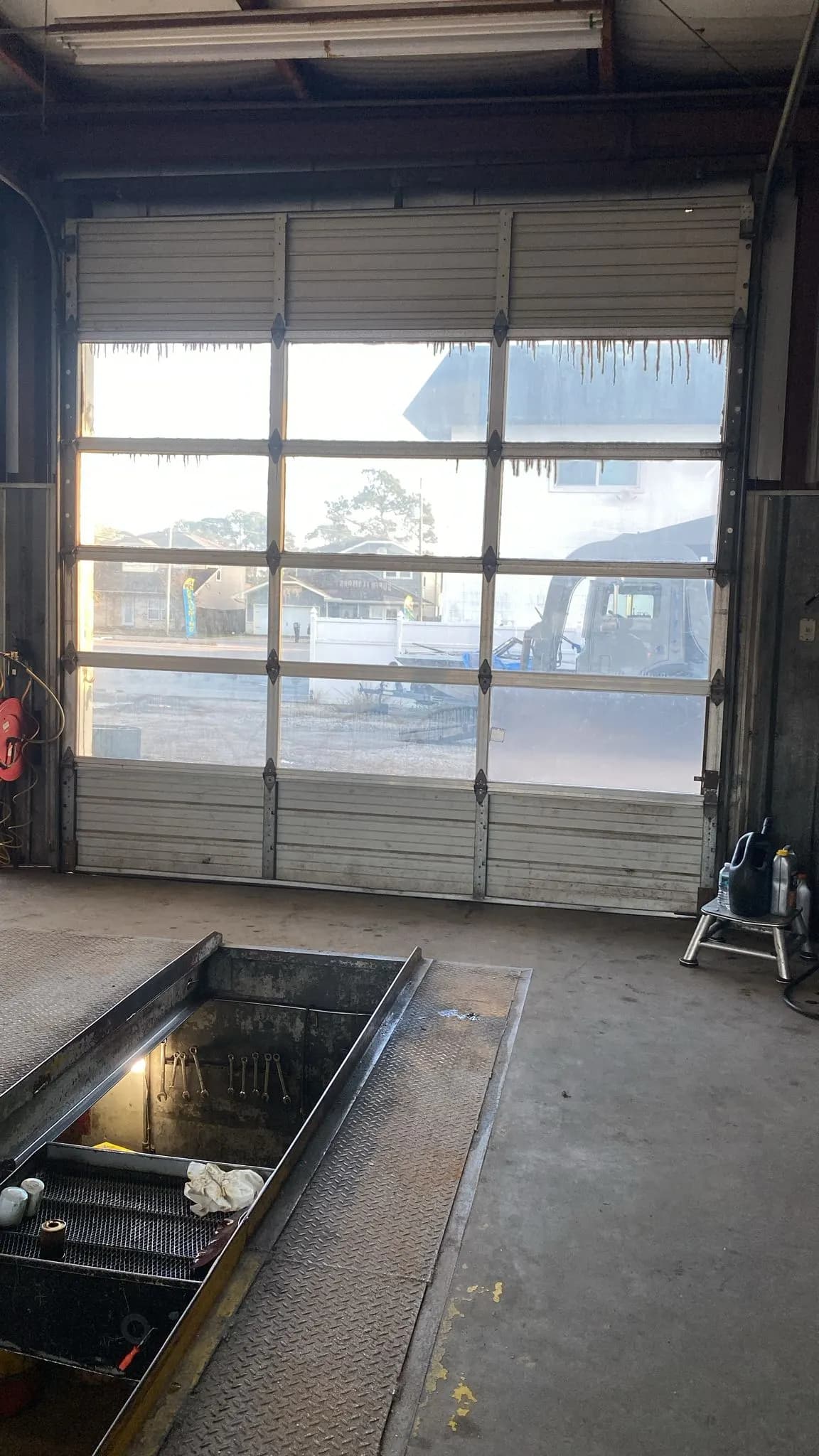 Full-view glass garage door seen from inside the garage