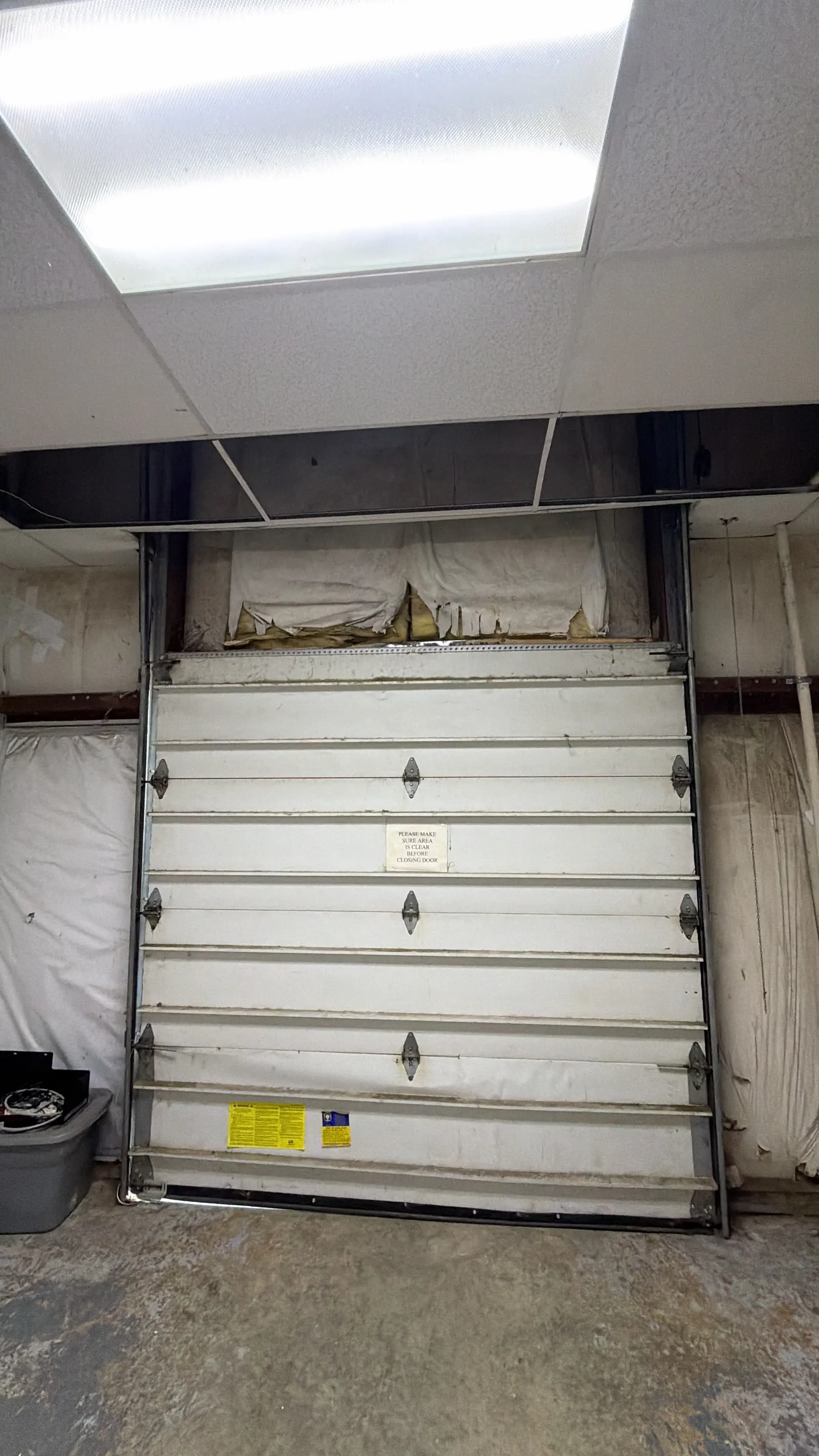 Commercial sectional door inside a warehouse loading bay