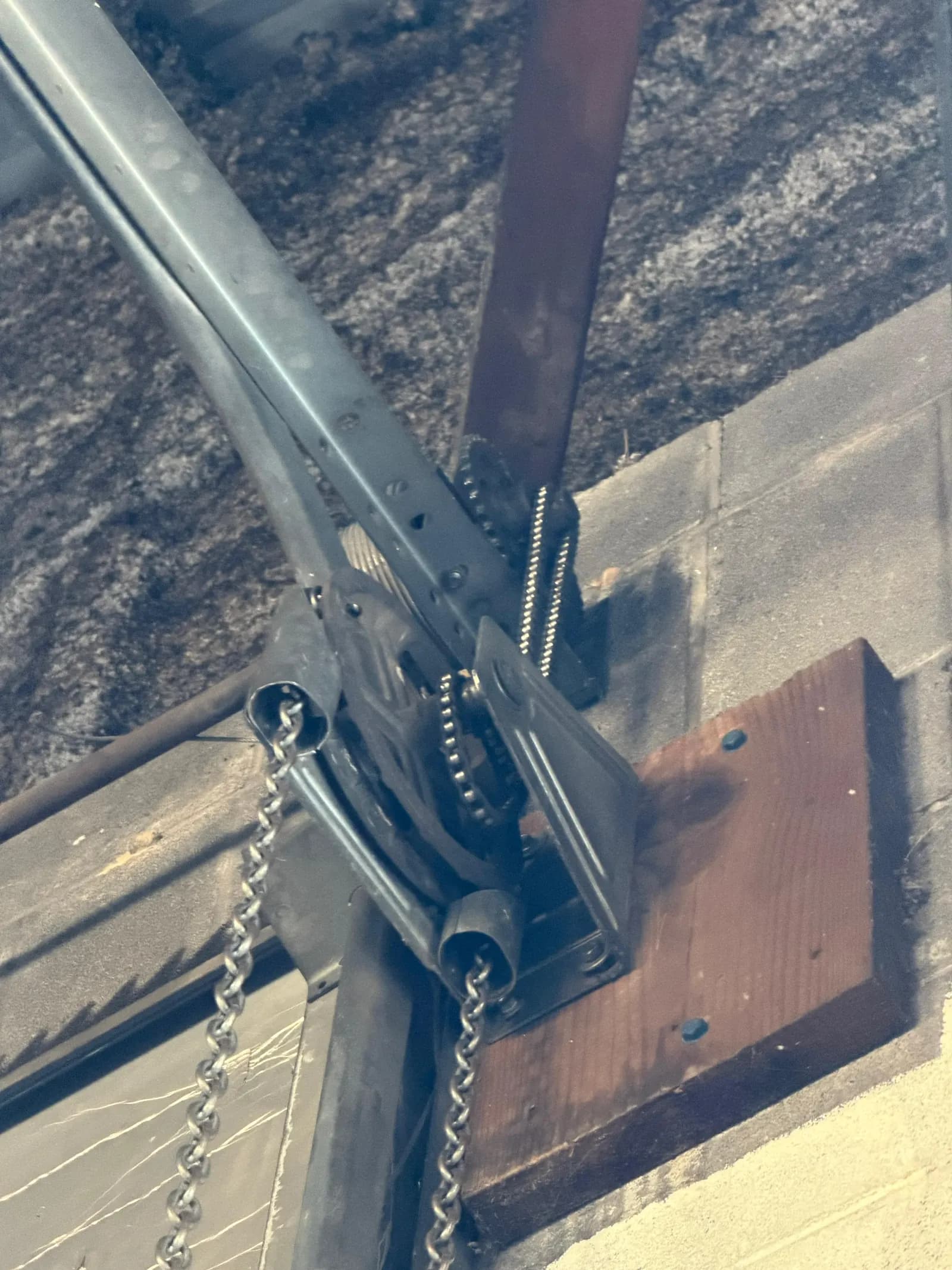 Chain hoist and drive on a commercial door, close-up