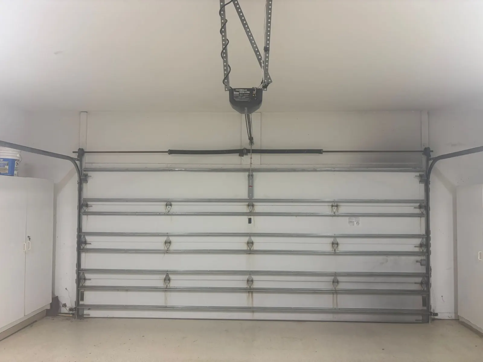 Garage door with opener and torsion spring system, inside view