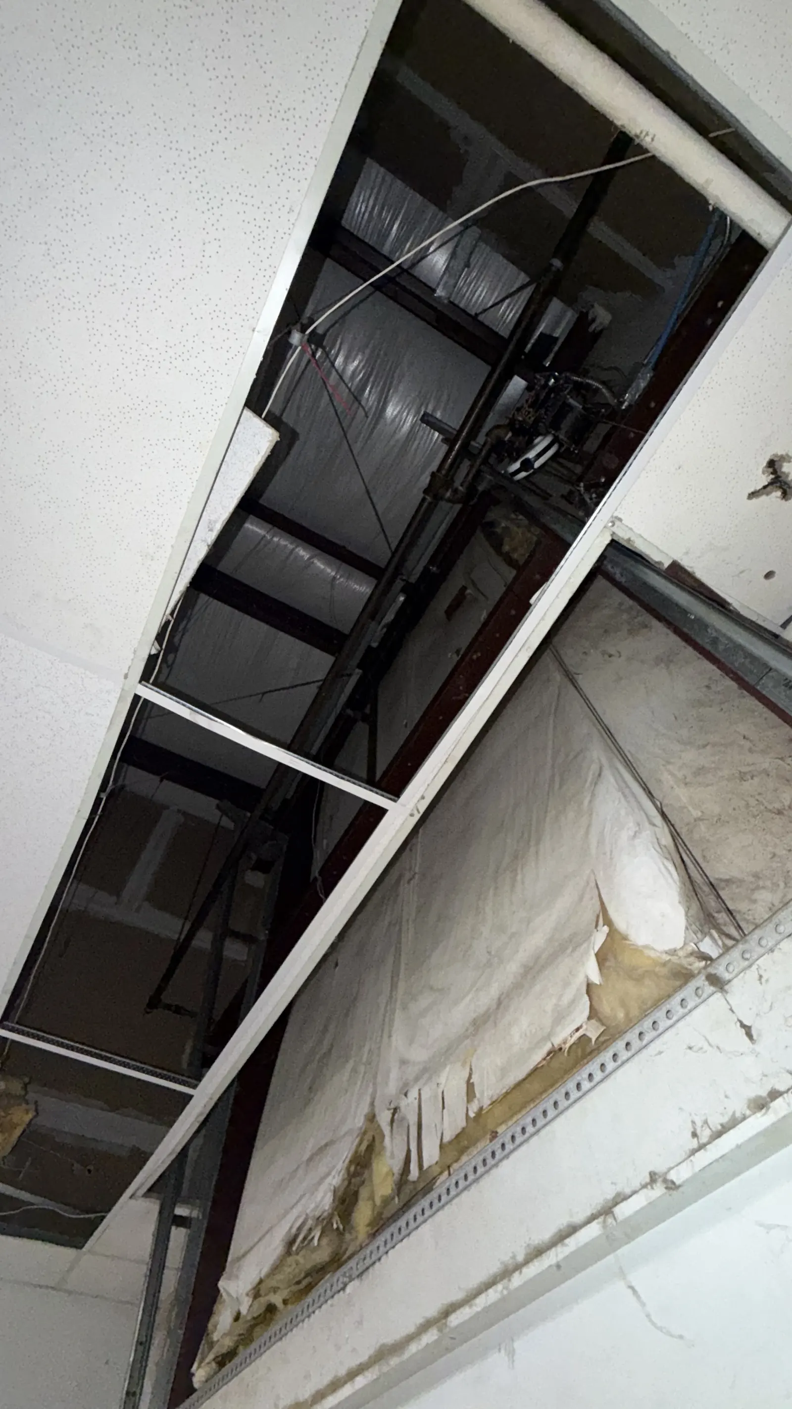 Damaged garage door sections bent out of alignment
