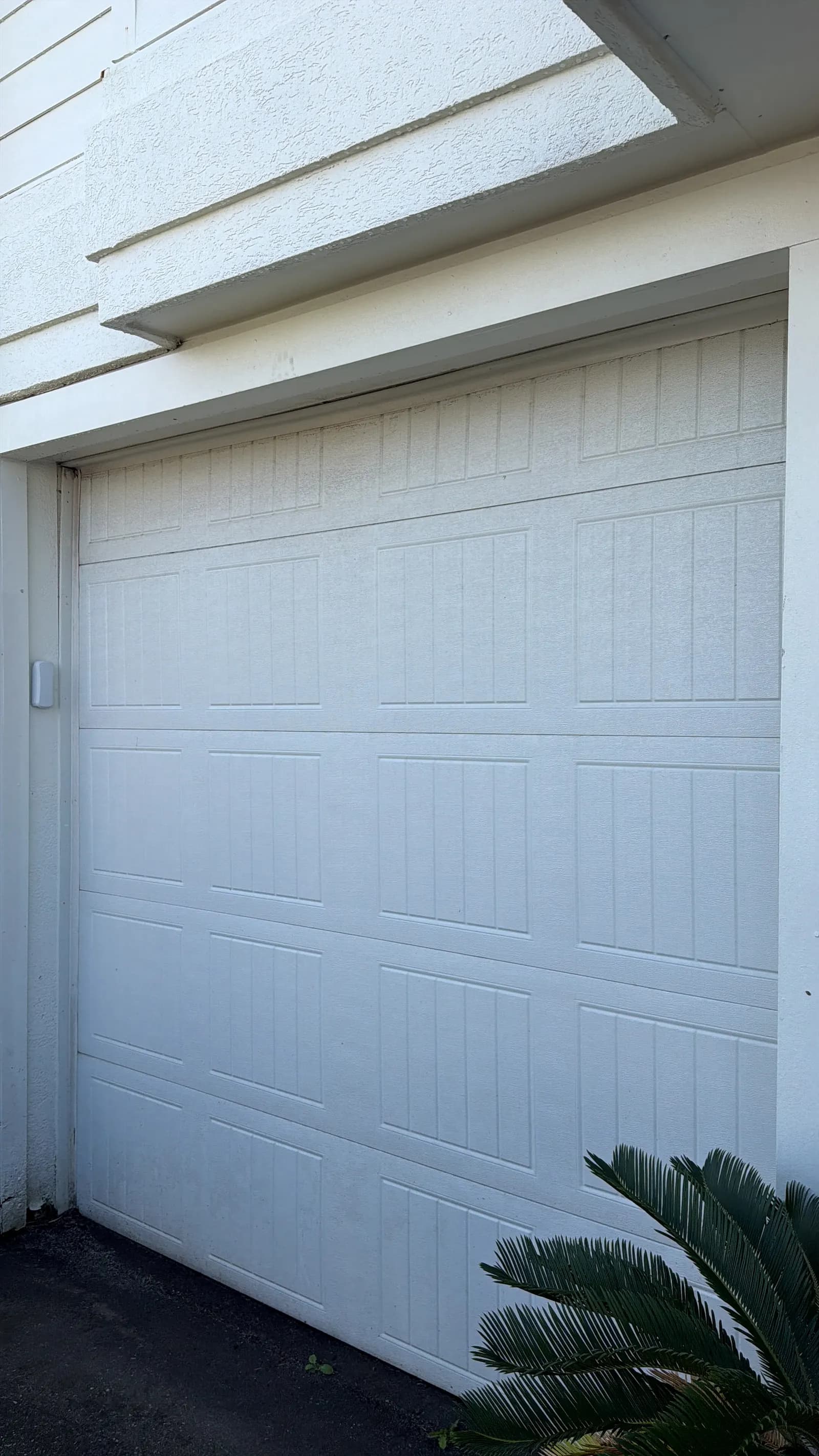 Large white insulated garage door, closed