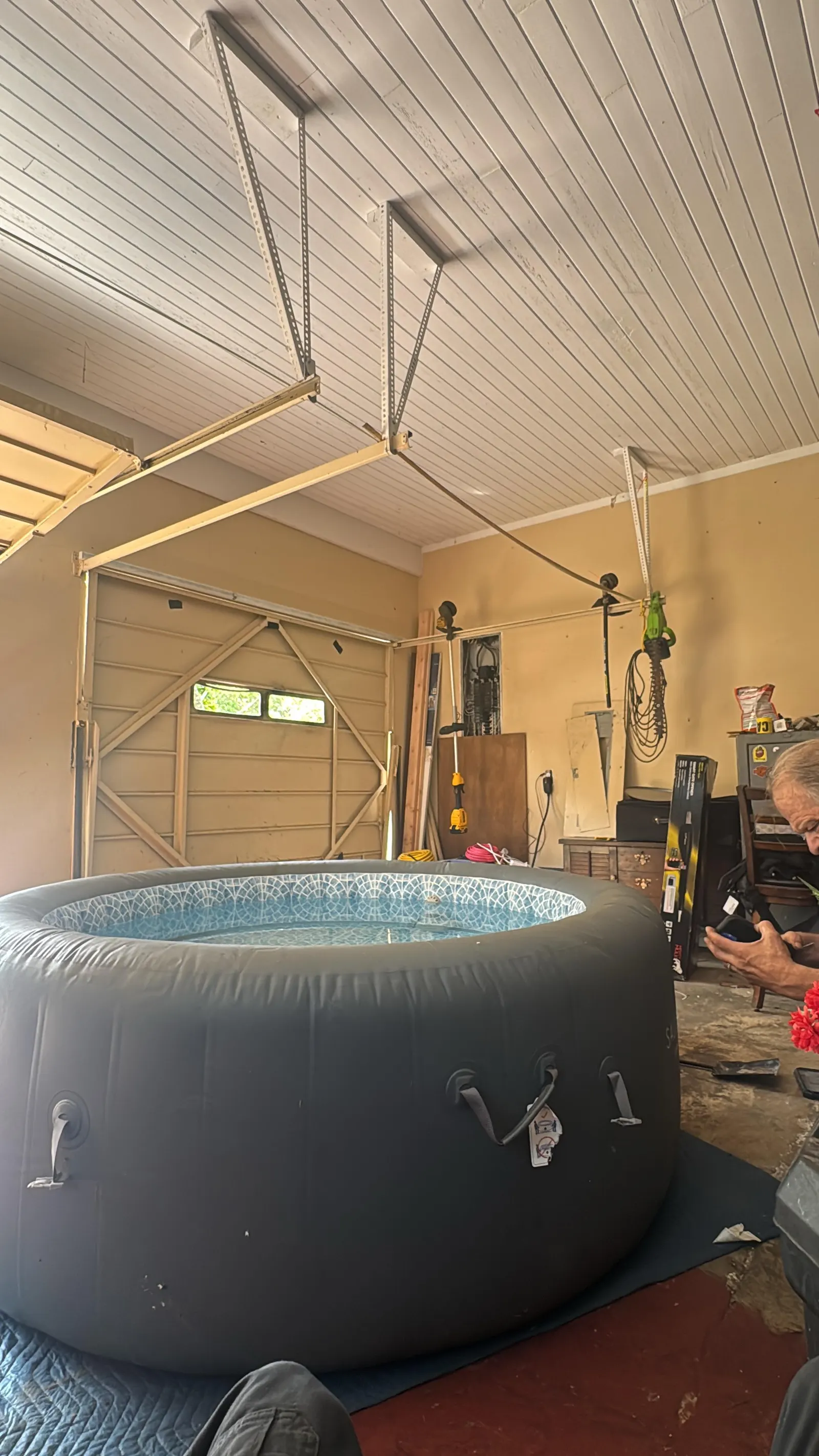 Garage interior with the door open and opener overhead