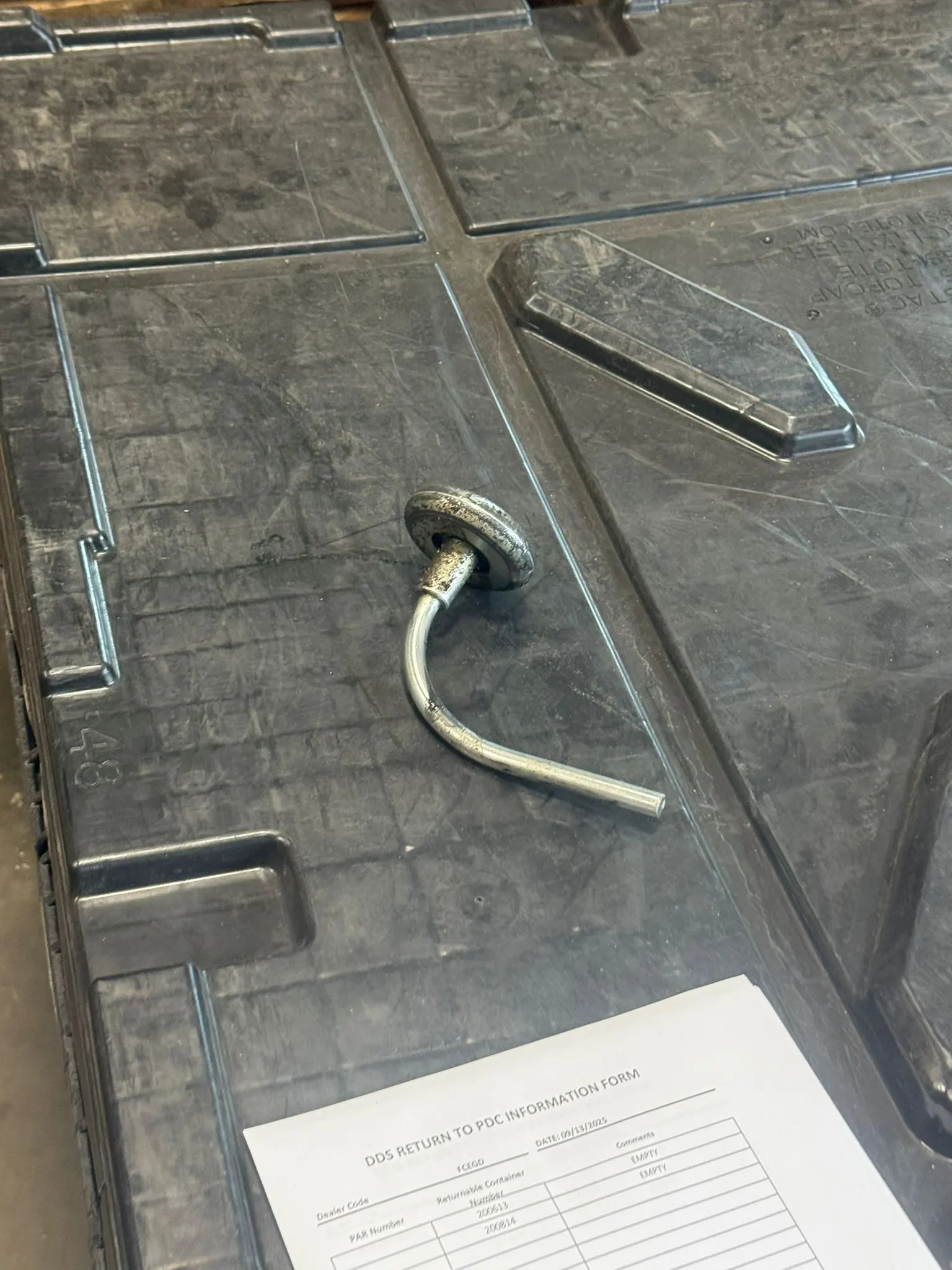 Garage door lock handle on a steel panel