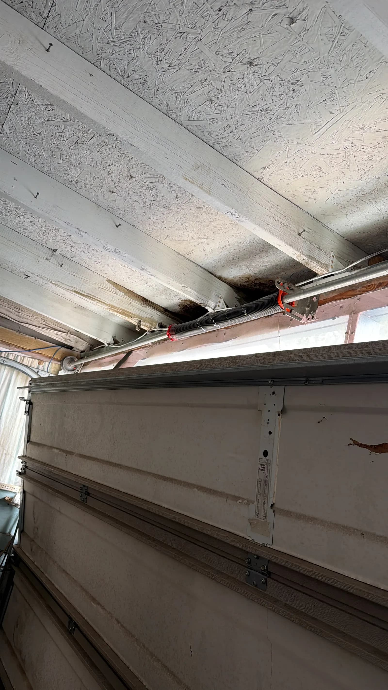 Commercial door top section and track hardware