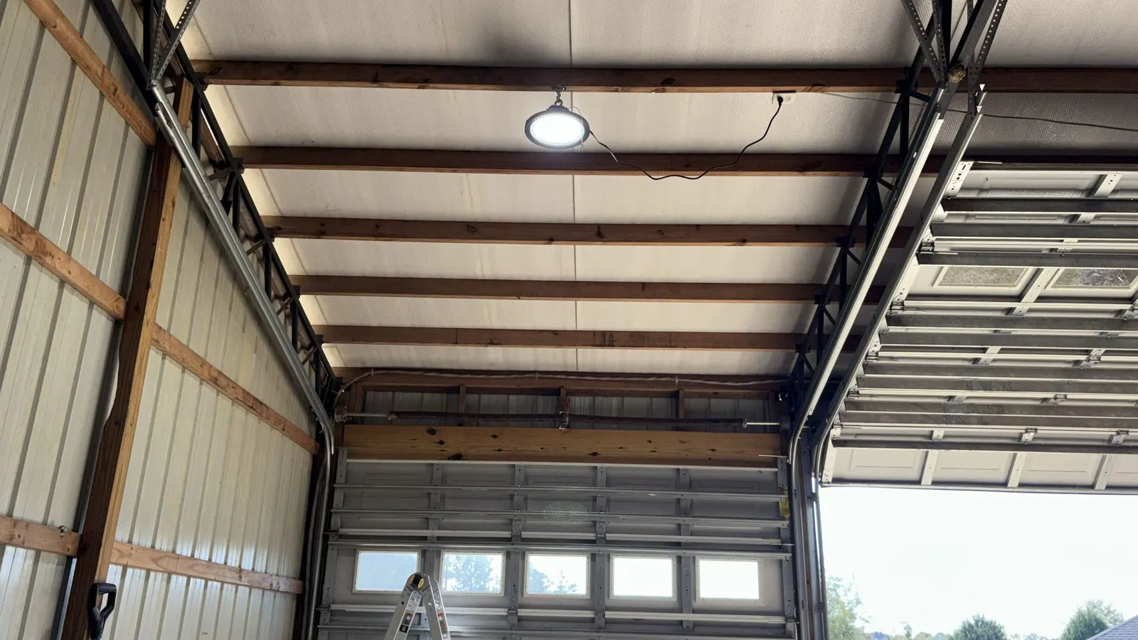 Commercial door with window section and overhead lighting
